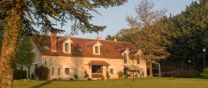 a large white house with a brown roof at Les Aulnaies - B&B in Mareuil-sur-Cher