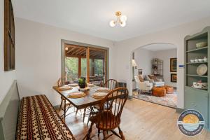 a dining room with a table and chairs at Lake Geneva Escape 4BR Arcade Fire Pit and Deck in Lake Geneva