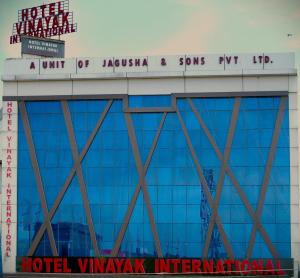 a building with a sign on top of it at Hotel Vinayak International in Muzaffarpur