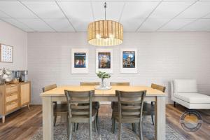a dining room with a table and chairs at Lake Como Condo with Lake Views and Pool in Lake Geneva