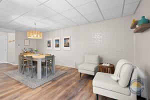a dining room with a table and a chair at Lake Como Condo with Lake Views and Pool in Lake Geneva +8 photos