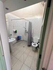 a bathroom with a toilet and a sink at Casa G in Bridlington +17 photos