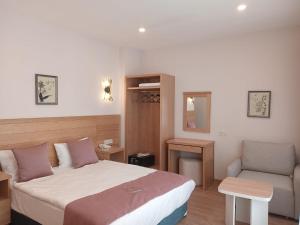 a hotel room with a bed and a chair at Vera Life Hotel in Istanbul +49 photos