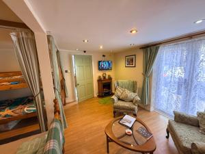 a living room with a couch and a table at Casa G in Bridlington