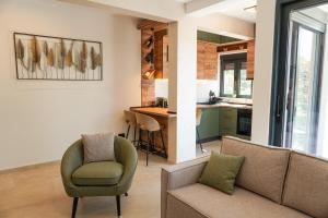 a living room with two chairs and a couch at Casa Oliva Tivat in Tivat