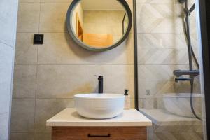 a bathroom with a sink and a mirror at Casa Oliva Tivat in Tivat +12 photos