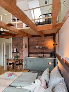a living room with a couch and a kitchen at FOUR ROOMS Carlsbad Authentic in Karlovy Vary