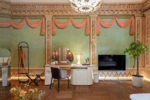 a living room with a table and a television at Residence 9 in Krakow