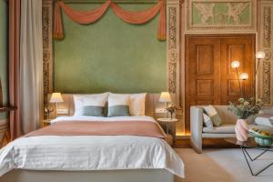 a bedroom with a large bed and a couch at Residence 9 in Krakow
