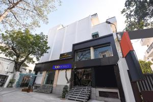 a building with a sign that reads ego cities at FabHotel The White Cliff Inn - Near Max Hospital Saket in New Delhi