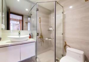 a bathroom with a toilet and a sink and a shower at Landmark City View - Apartment in Ho Chi Minh City +50 photos