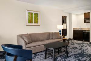 a living room with a couch and a table at Fairfield Inn & Suites by Marriott Denver Aurora/Parker in Foxfield