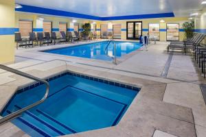 a pool with blue water in a hotel room at Fairfield Inn & Suites by Marriott Denver Aurora/Parker in Foxfield