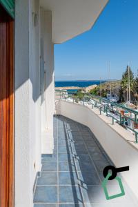a balcony with a view of the ocean at Hotiday Gallipoli Lungomare in Gallipoli
