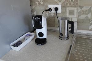 a coffee maker sitting on a counter in a kitchen at MaMo B&B in Nocera Terinese