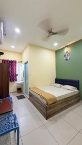 a bedroom with a bed in a room at Gravity Groups VHR Residency - near santho lawns in Pondicherry