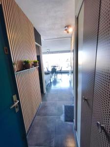 a hallway with a door leading to a room at Naturiste Cap d'Agde Héliopolis K 106 in Cap d'Agde +3 photos