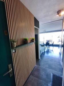 a room with a hallway with a living room at Naturiste Cap d'Agde Héliopolis K 106 in Cap d'Agde