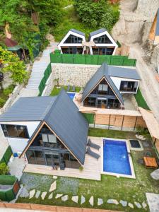 an aerial view of a house with a swimming pool at Tina Bungalov in Sapanca