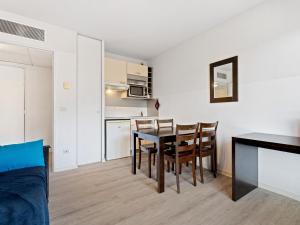 a kitchen and dining room with a table and chairs at Virginia N213 - 2p4 in Grasse