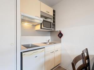a small kitchen with a sink and a microwave at Virginia N213 - 2p4 in Grasse +2 photos