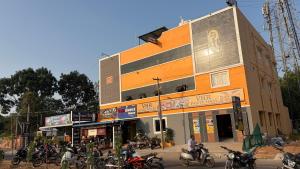 a group of motorcycles parked in front of a building at Gravity Groups VHR Residency - near santho lawns in Pondicherry