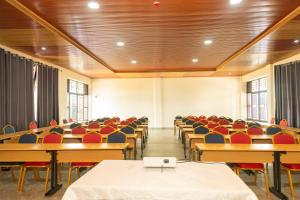 an empty lecture hall with desks and chairs at Kibeho Pilgrimage Center in Giseke