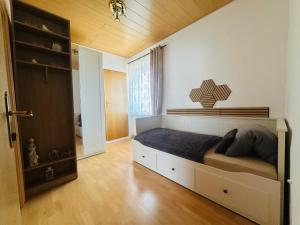 a bedroom with a bed and a wooden ceiling at Ferienhaus Silke in Knittelfeld