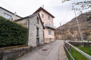 a building on the side of a road at Centovalli Rustic near Locarno in Intragna