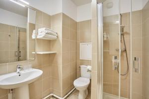 a bathroom with a toilet and a sink and a shower at MAISON SAINT CHARLES - ASSOCIATION HABITAT et HUMANISME ILE DE FRANCE in Paris