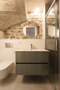 a bathroom with a sink and a shower at Charming Rustico Losone near Locarno in Losone