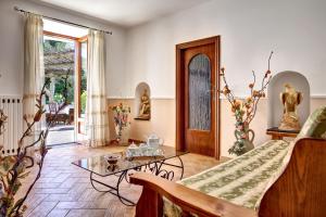 a living room with a couch and a table at GOCCE VILLAS - Il Frantoio in Massa Lubrense