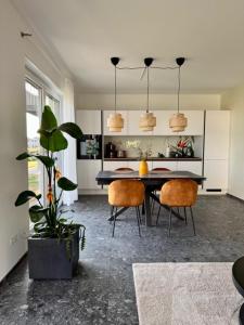 a dining room with a table and two chairs at See you! in Pouch