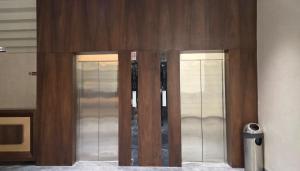 two glass elevators in a room with at Hotel Waterlily in Indore