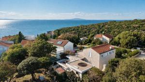 an aerial view of a house next to the ocean at Villa GIUSEPPE in Potocnica