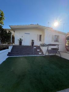 a house with a lawn in front of it at Villa Amelia in Capaci