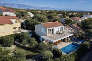 an aerial view of a house with a swimming pool at Villa GIUSEPPE in Potocnica
