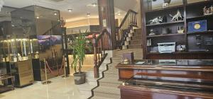 a store with a staircase and a piano in a room at Gran Hotel Paraiso in Llanes