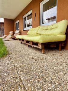 a group of couch sitting outside of a house at Voll ausgestattete, helle Ferienwohnung auf 80 qm in Wutöschingen
