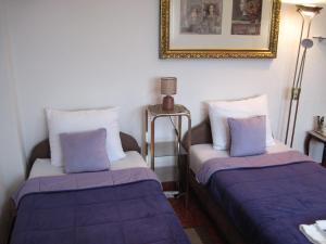 a room with two beds and a picture on the wall at Apartment Yasica 2 in Izačić