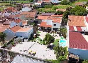 an aerial view of a town with houses at Villa familiar com piscina e jacuzzi a 30 min de Lisboa in Torres Vedras +79 photos