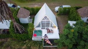 an aerial view of a white house with a tent at Phunapat camping in Cha Am