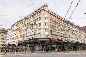 a large building on the corner of a street at Spacious City View Apartment - Prime Location Biel in Biel +39 photos