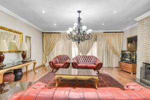 a living room with a couch and a table at The Adress beautiful in Midrand