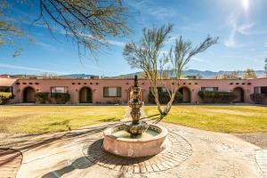 a fountain in front of a building at Tanque Verde Guest Ranch in Tucson