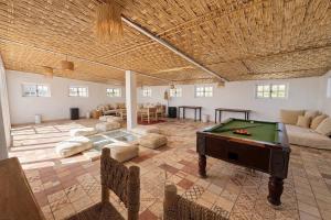 a large room with a pool table in it at Pistach Océan Maison 4 chambres vue Océan in Wassane