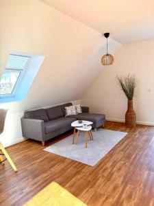 a living room with a couch and a table at Inselhus in Burg auf Fehmarn