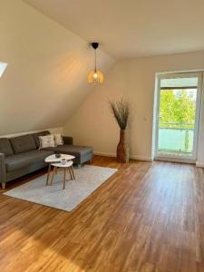 a living room with a couch and a table at Inselhus in Burg auf Fehmarn