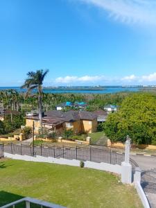 an aerial view of a house with a fence at Lagoon View Holiday Home in Montego Bay