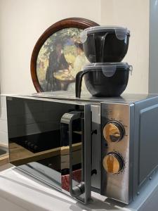 a microwave sitting on top of a counter at The Cellar on Hornby in Morecambe